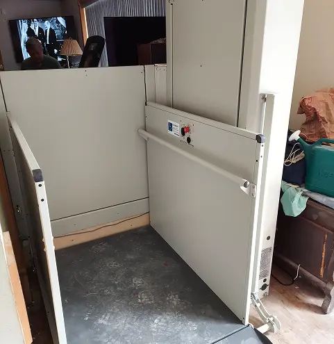 Indoor wheelchair lift in a residential setting.
